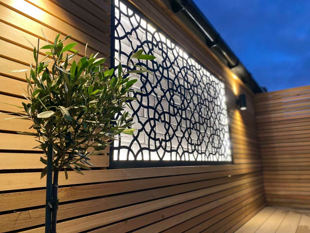 Back garden in Radlett - backlit metal trellis